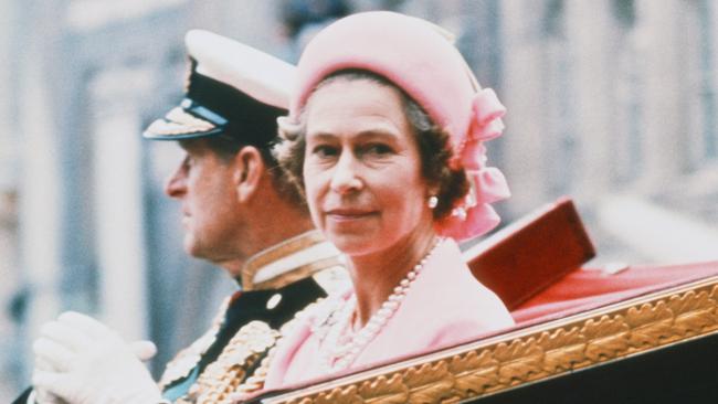 Queen Elizabeth II and Prince Philip ride back to the Palace, after a celebration for her Silver Jubilee in 1977. Picture: Getty Images