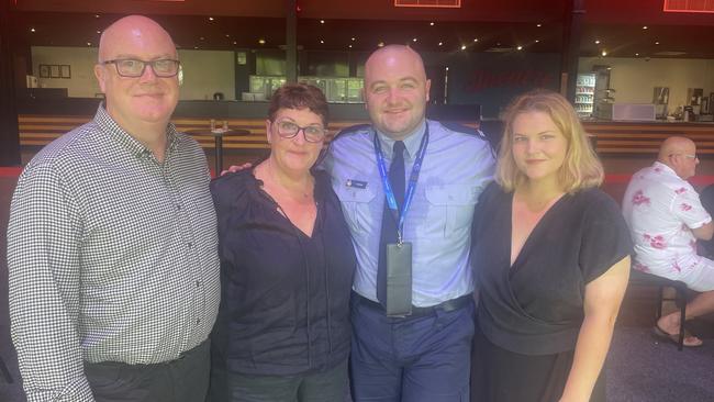 Officer Tom with his parents and partner, Helena