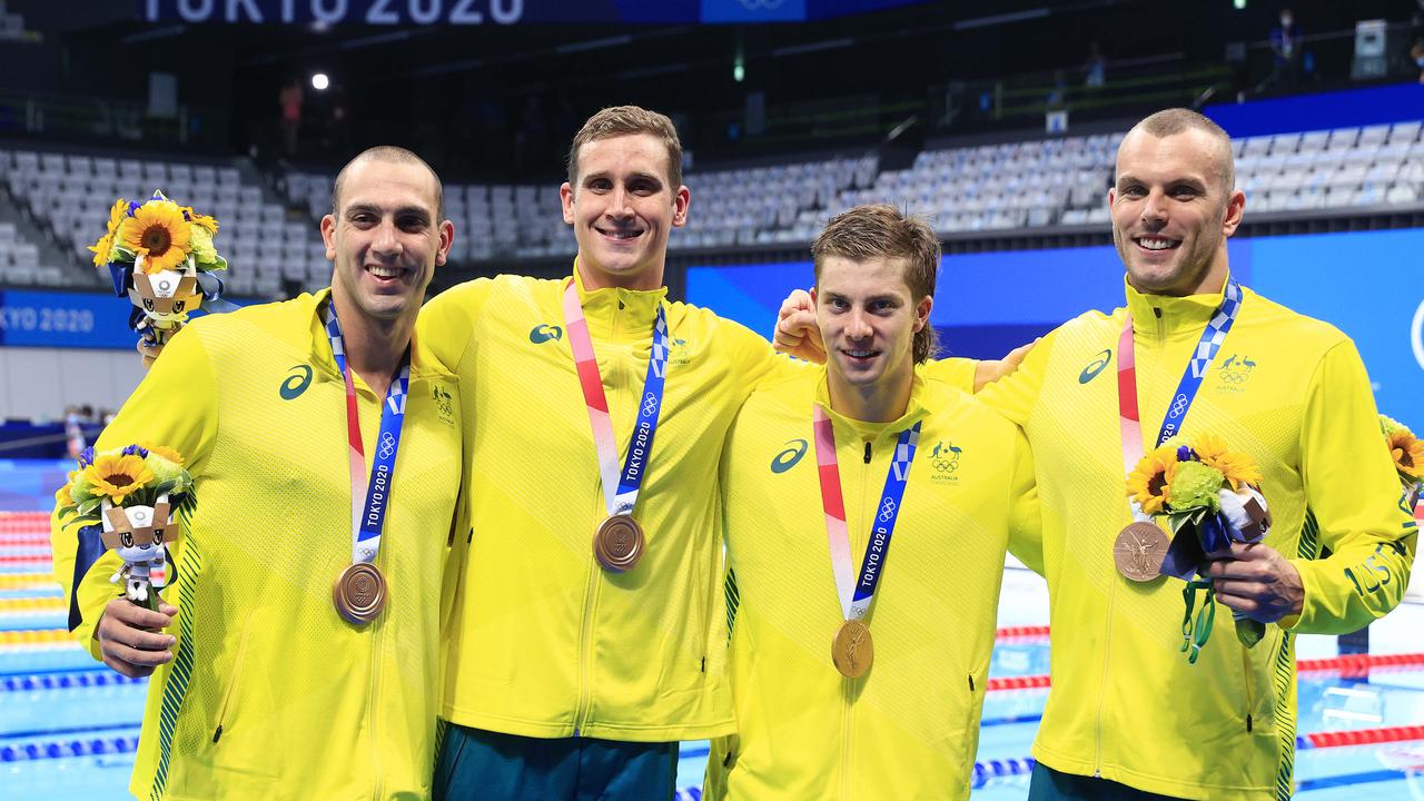 Matt Temple (middle right) and Kyle Chalmers (right) after winning bronze at the Tokyo Olympics. Picture: Adam Head