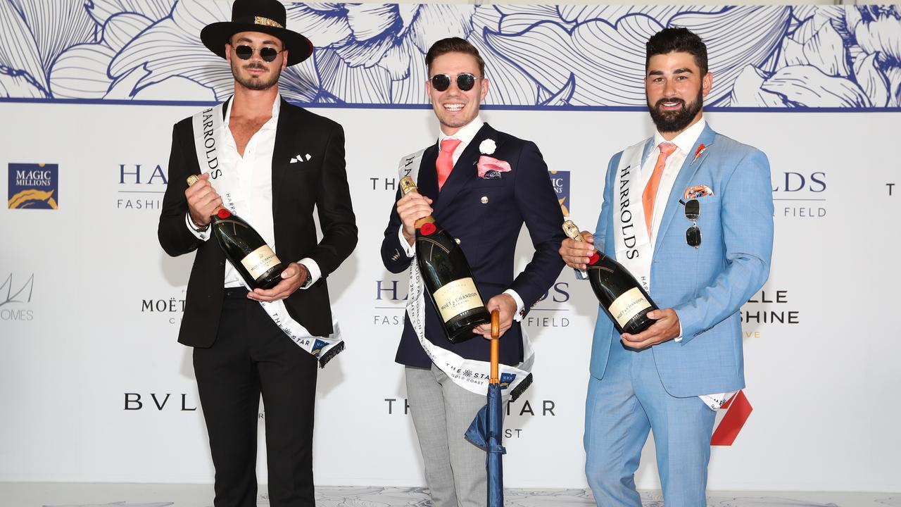 Mens fashion: 2ND place Cam Marsh, Winner Sam Brazel and 3RD Alexanda Daniels at the Magic Millions race day. Photo: Jason O'Brien