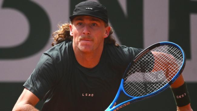 PARIS, FRANCE - MAY 27: Max Purcell of Australia runs for a shot against Henri Squire of Germany in the Men's Singles first round match on Day Two of the 2024 French Open at Roland Garros on May 27, 2024 in Paris, France. (Photo by Clive Mason/Getty Images)