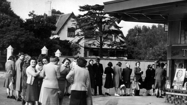 The queue at a milk bar at the corner of Inkerman road and Hotham street, St Kilda.