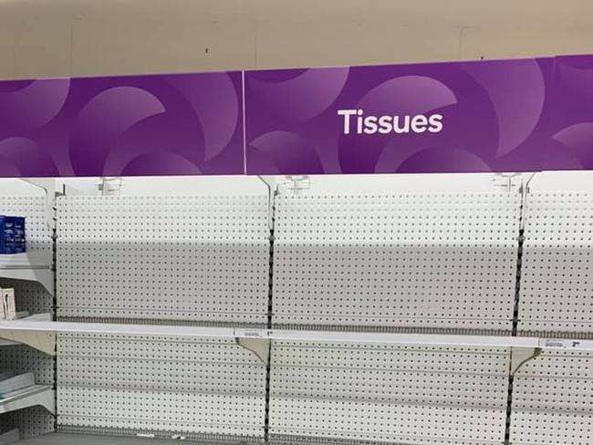 Empty shelves are pictured at Campbelltown Woolworths as Sydneysiders stockpile toilet paper and tissues amid coronavirus fears. Picture: Teneille Campbell