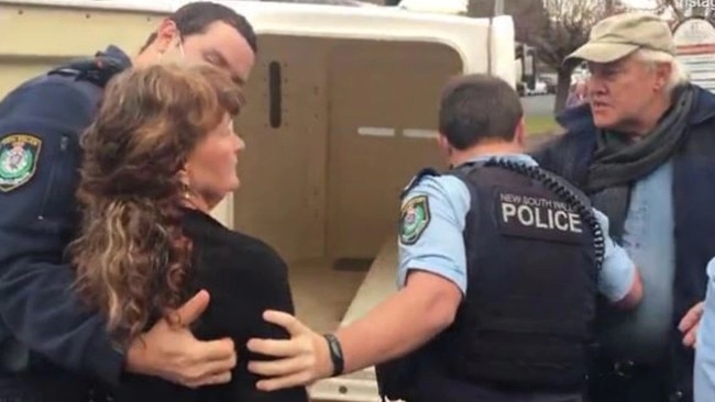 A still from a video captured by a customer shows Mrs Kleeberg being escorted to the police wagon while Mr Kleeberg argues with police. The video of the violent arrest was widely shared on social media.