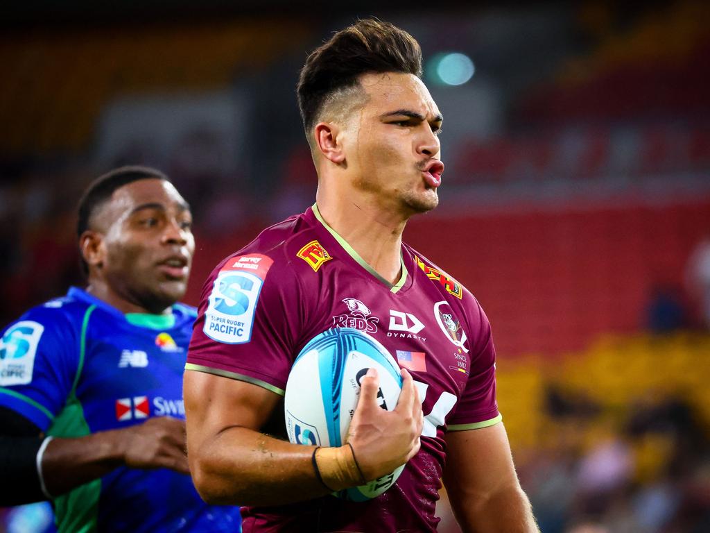 Queensland Reds star Jordan Petaia charges through Fijian Drua's defence at Suncorp Stadium. Picture: Patrick HAMILTON / AFP