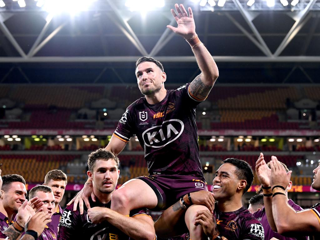 Darius Boyd is chaired off the field by his teammates.