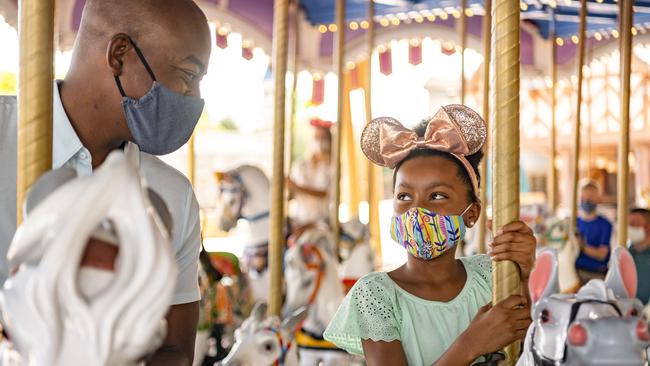 Guests remain physically distanced and wear masks at Walt Disney World Resort theme parks. Picture: Getty Images.