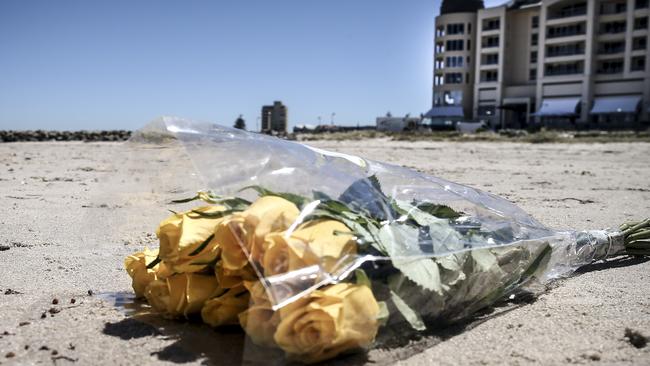 Floral tribute left on the sand for Nitisha Negi near the Glenelg breakwater. Pic AAP/Mike Burton