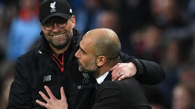 Liverpool's German manager Jurgen Klopp (L) greets Manchester City's Spanish manager Pep Guardiola after the English Premier League football match between Manchester City and Liverpool at the Etihad Stadium in Manchester, north west England, on March 19, 2017. / AFP PHOTO / Paul ELLIS / RESTRICTED TO EDITORIAL USE. No use with unauthorized audio, video, data, fixture lists, club/league logos or 'live' services. Online in-match use limited to 75 images, no video emulation. No use in betting, games or single club/league/player publications.  /