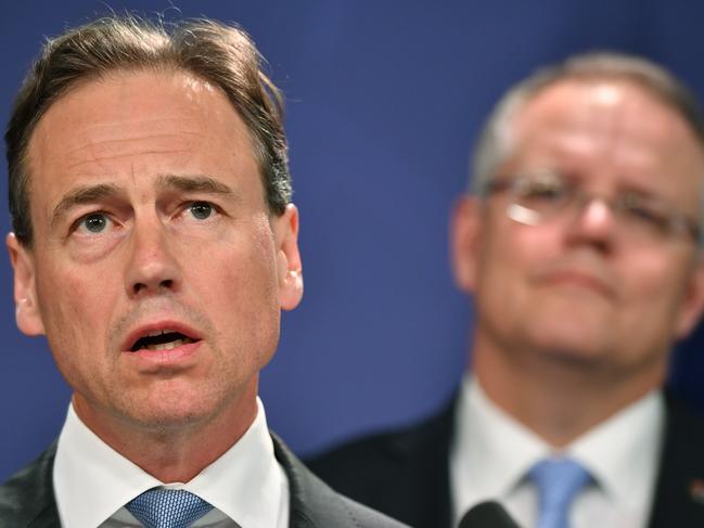 Minister for Health Greg Hunt (left) and Prime Minister Scott Morrison speak to the media in Sydney, Tuesday, October 9, 2018. Scott Morrison says the aged care royal commission will be based in Adelaide, where shocking abuse of residents of the Oakden nursing home first came to light. (AAP Image/Joel Carrett) NO ARCHIVING