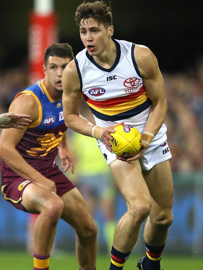 Jake Kelly of the Crows looks to kick during the Round 18 match against Brisbane. Picture: AAP Image/Jono Searle