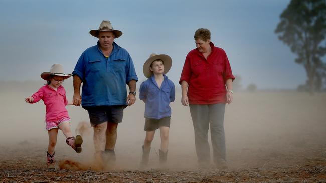 Richard and Janie Tink with kids Darcy 8 and Nelly 6 pictured on their drought-affected farm outside of Narromine in the central west of NSW. Picture: Toby Zerna