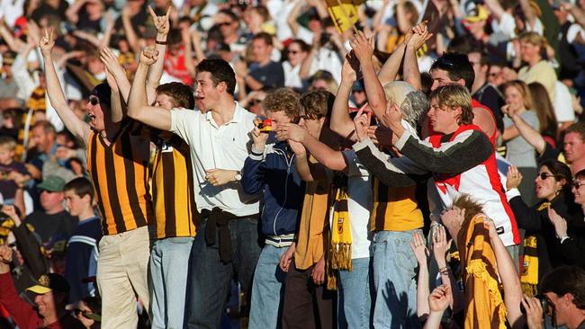 Hawks fans — and one Sydney supporter — acknowledge Hawthorn players as they leave Waverley Park for the last time.