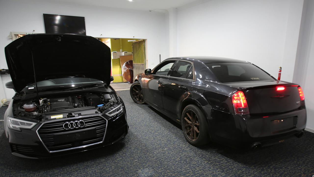 An Audi and black Chrysler seized under AFP-led Operation Ironside in NSW. Picture: AFP