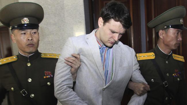 American student Otto Warmbier, centre, is escorted at the Supreme Court in Pyongyang, North Korea in 2016. 