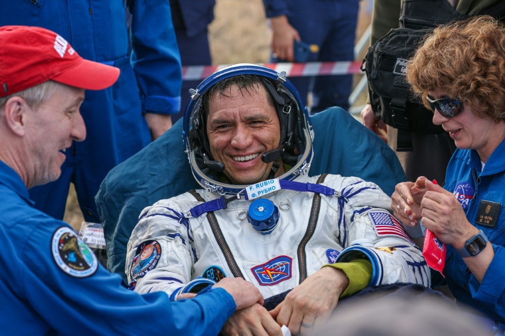 In this handout photograph taken and released by Roscosmos on September 27, 2023, Expedition 69 NASA astronaut Frank Rubio is helped by specialists after his landing in the Soyuz MS-23 capsule in a remote area near the town of Dzhezkazgan, Kazakhstan