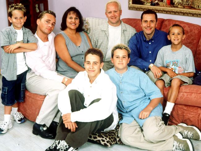 The expanded family has been the subject of a reality TV show. Pictured with four children (Saffron absent) and their surrogates. Picture: Supplied