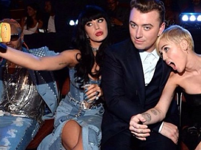 Celebrity mixer ... Sam Smith with Katy Perry and Miley Cyrus.