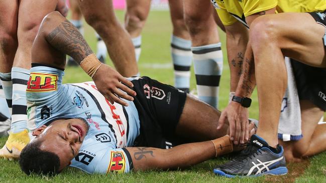 SYDNEY, AUSTRALIA - MARCH 27:  Sione Katoa of the Sharks is assisted after sustaining an injury during the round three NRL match between the Parramatta Eels and the Cronulla Sharks at Bankwest Stadium on March 27, 2021, in Sydney, Australia. (Photo by Matt King/Getty Images)