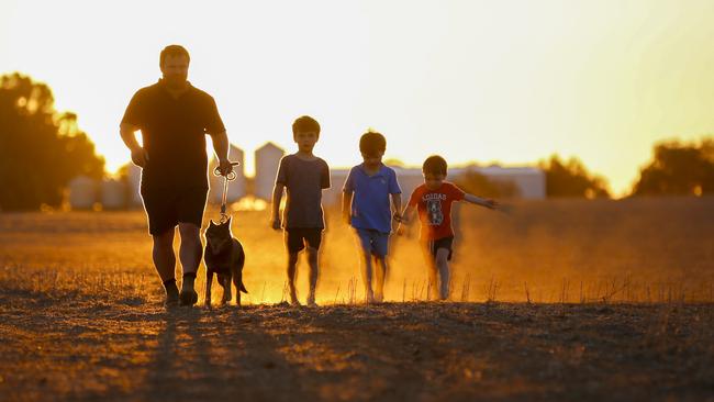 The kids once played and hid in thick crops, now they slide down sandhills. Picture: Alex Coppel