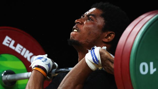 GOLD COAST, AUSTRALIA - APRIL 05:  Olivier Heracles Matam Matam of Cameroon competes during the Weightlifting Men's 62kg Final on day one of the Gold Coast 2018 Commonwealth Games at Carrara Sports and Leisure Centre on April 5, 2018 on the Gold Coast, Australia.  (Photo by Dean Mouhtaropoulos/Getty Images)