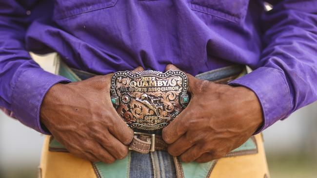 A Mount Isa Indigenous Rodeo Championship rider with a buckle he won at Quamby Rodeo in 2022. Picture: Peter Wallis