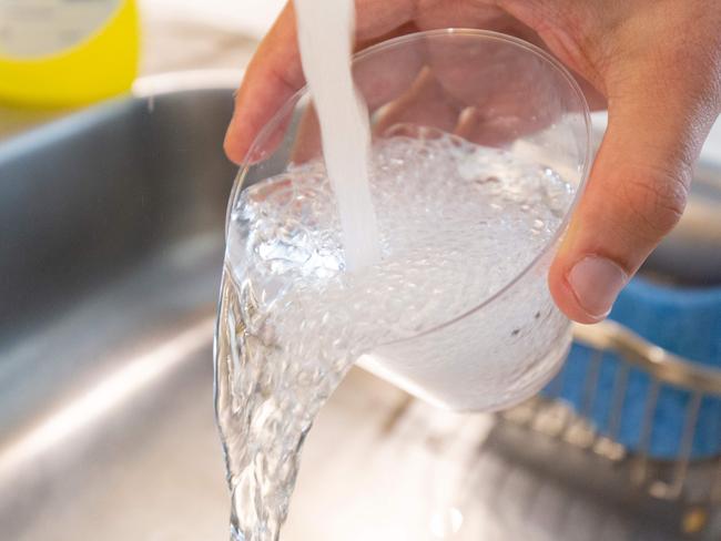 Tap water is seen in this photo illustration in Washington, DC, on August 19, 2019. - A study published on August 19, 2019 links exposure to fluoridated tap water during pregnancy to lower IQ scores in infants, but several outside experts expressed concern over its methodology and questioned its findings.  Fluoride has been added to community water supplies in industrial countries to prevent tooth decay since the 1950s. Very high levels of the mineral have been found to be toxic to the brain, though the concentrations seen in fluoridated tap water are generally deemed safe. (Photo by Alastair Pike / AFP)