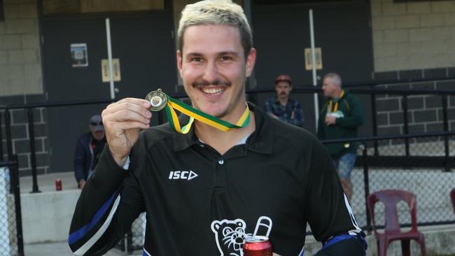 Winners are grinners: Brolic celebrates with his medal. Picture: Field of View Sports Photography