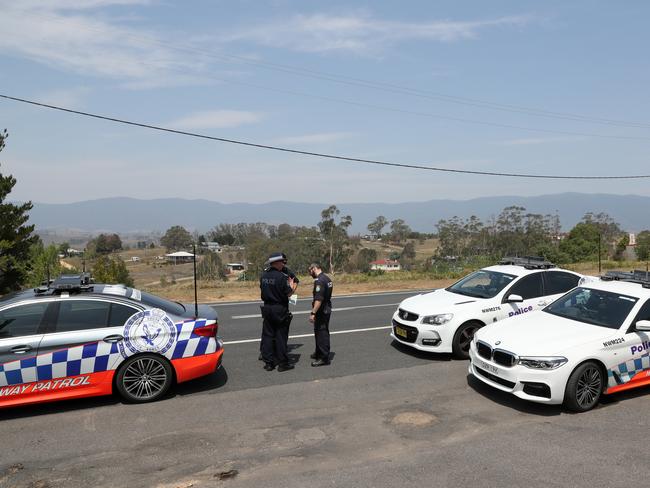 NSW Police prepare for the impending Werri Berri fire as it threatens Bemboka in December 2019. Picture: Jonathan Ng