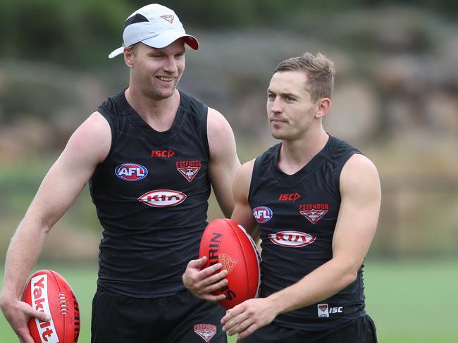 Ex Bulldogs player Jake Stringe (left) and Ex GWS player Devon Smith are seen at Essendon's AFL training in Melbourne, Monday, November 27, 2017. It is Essendon's first training sessions along with their new recruits for the 2018 season. (AAP Image/David Crosling) NO ARCHIVING