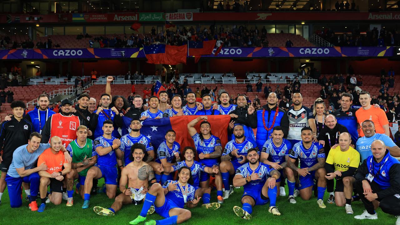 Players and support staff of Samoa pose for a photo following their side's victory in the Rugby League World Cup Semi-Final. Picture: Matthew Lewis/Getty Images for RLWC