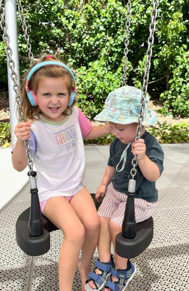 Four-year-old Aoife and her younger brother Mathias enjoying the swing at a Queensland playground. Photo: Contributed