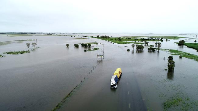 Drone images of flooding at Goorganga Plains, just south of Proserpine, in January, 2022, which shut the Bruce Highway to motorists for days. Photos: Robert Murolo