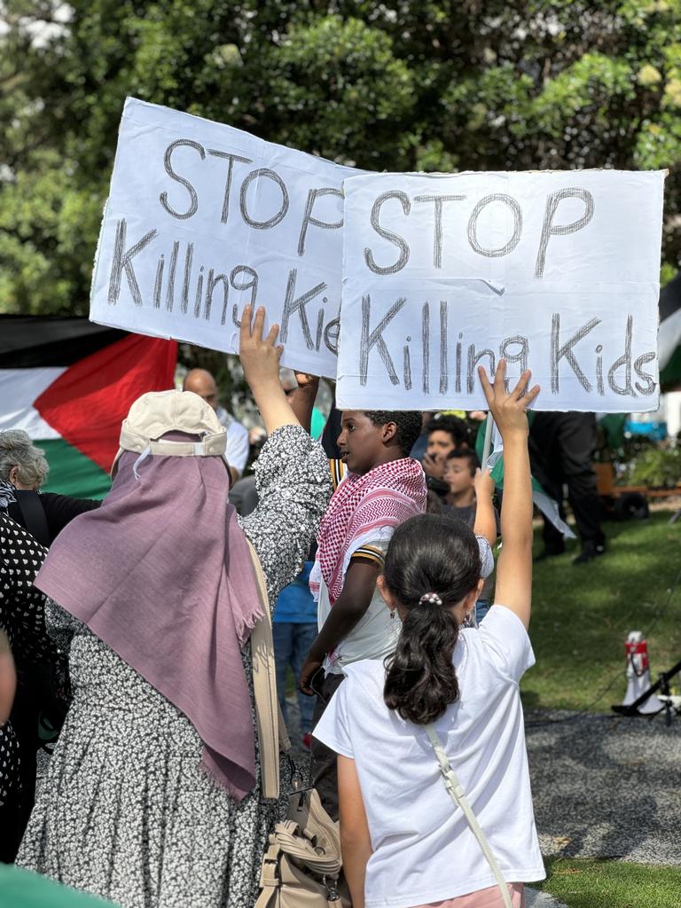 A protester holding a poster at a Palestine solidarity rally held at Victoria Park, Broadbeach on 18.11.23. Since October 7, more than 11,100 Gazans have been killed. Of that, 5,500 are children. Picture: Amaani Siddeek