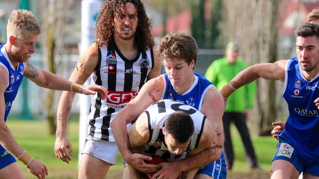 Action from the St Peter's Old Collegians v Payneham Norwood Union division one Adelaide Footy League clash. Picture: Brayden Goldspink