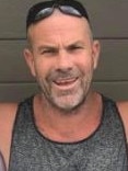 Israel Colin Buggy, 47, is in jail for his attack on boxer Danny Hawkins at a Gympie home.