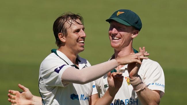 Rainbird and good friend Jordan Silk celebrate a wicket back in 2020. (AAP Image/Michael Dodge)