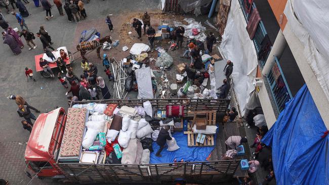 Displaced Palestinians in Rafah pack their belongings. Picture: AFP