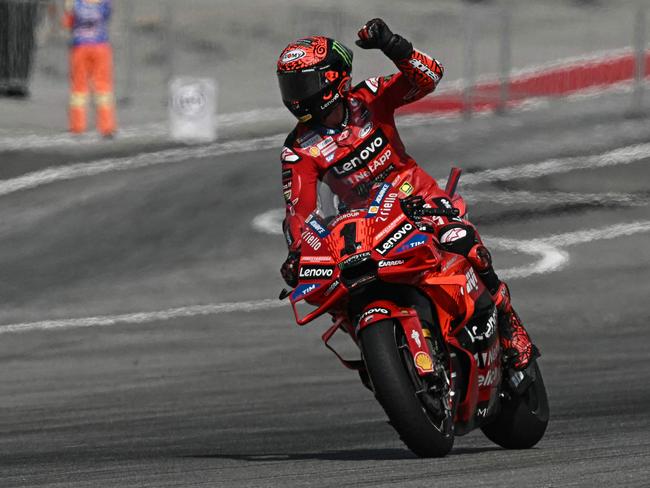 Ducati Lenovo Team's Italian rider Francesco Bagnaia celebrates as he crosses the finish line to win the MotoGP Malaysian Grand Prix. Picture: Lillian SUWANRUMPHA / AFP