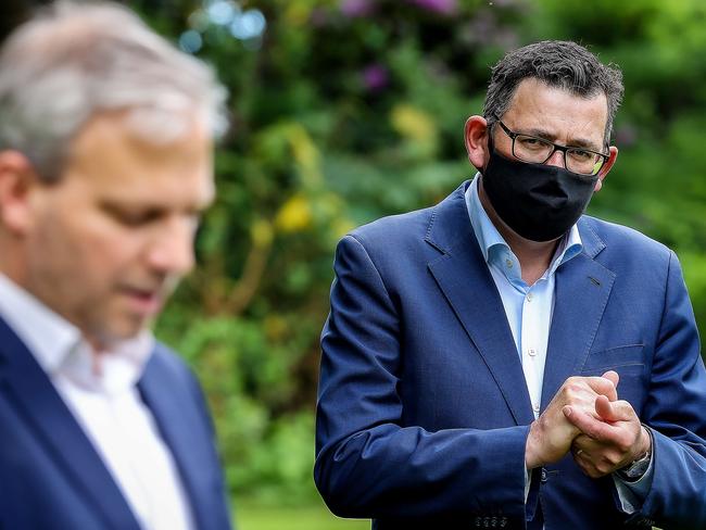 Former Victorian chief health officer Professor Brett Sutton and former Victorian Premier Dan Andrews on the first day of opening up again from a lockdown. Picture: Ian Currie