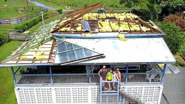 Simpson family on the balcone of their cyclone Debbie damaged Proserpine home.