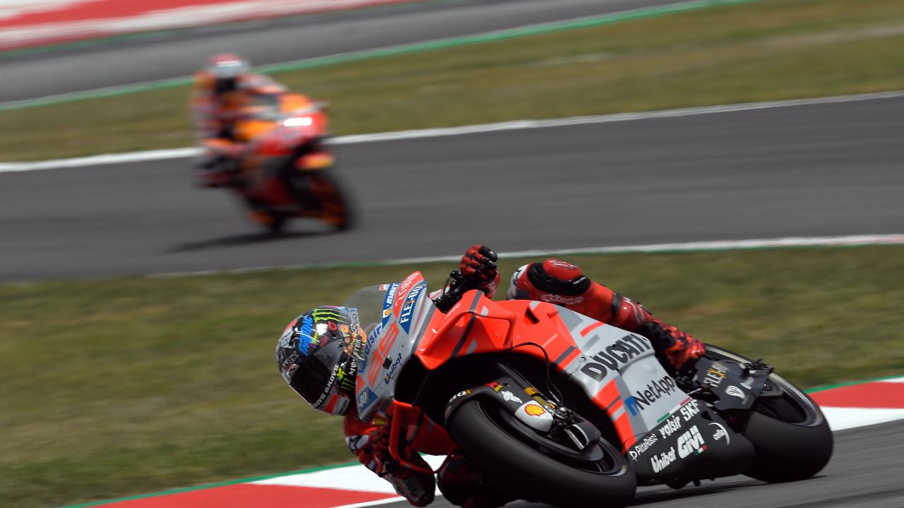 Ducati’s Spanish rider Jorge Lorenzo and Repsol Honda Team's Marc Marquez ride during the Catalunya MotoGP Grand Prix.