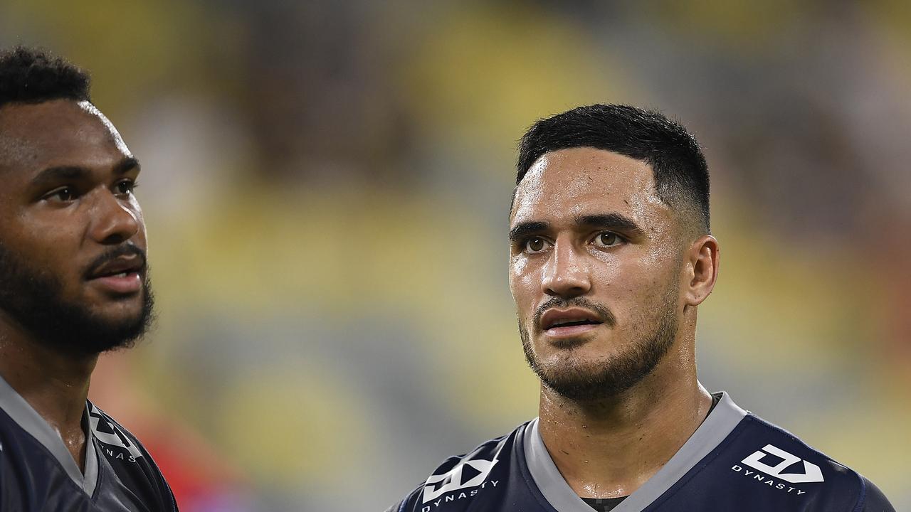 Valentine Holmes and Hamiso Tabuai-Fidow of the Cowboys look on after losing the round two NRL match between the Cowboys and the Dragons