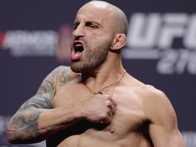 LAS VEGAS, NEVADA - JULY 01: Alexander Volkanovski of Australia poses on the stage during the UFC 276 ceremonial weigh-in at T-Mobile Arena on July 01, 2022 in Las Vegas, Nevada. (Photo by Carmen Mandato/Getty Images)
