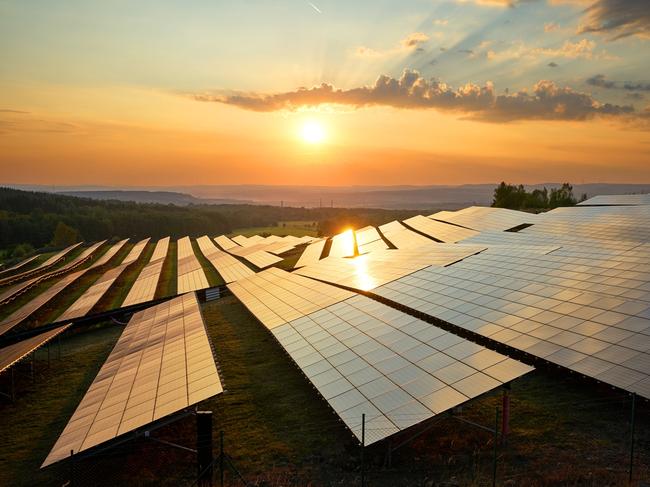 Photovoltaic panels of solar power station in the landscape at sunset. View from above. solar panel generic Townsville