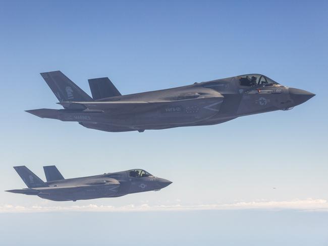 Two US Marine F35 jets fly in unison about 100km south of Darwin. Picture: Floss Adams.