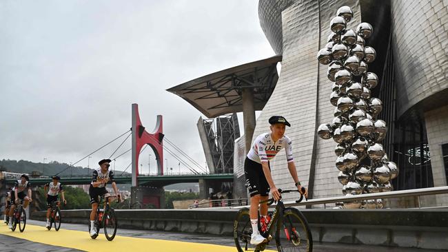 Tour de France cyclists ride past Bilbao’s Guggenheim two days before the start of the famous race. Picture: AFP