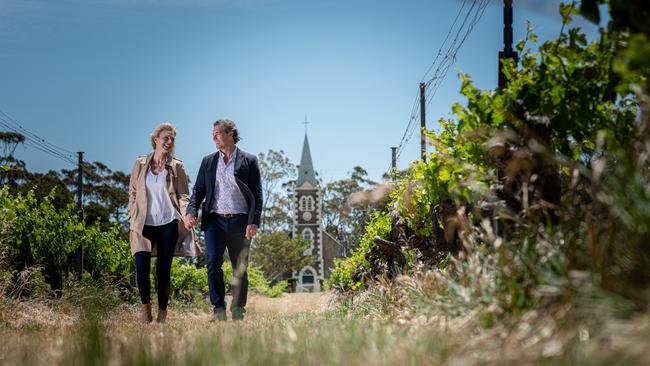 A couple walks through Henschke vineyards as part of its Ultimate Authentic Barossa Experience. Picture: supplied