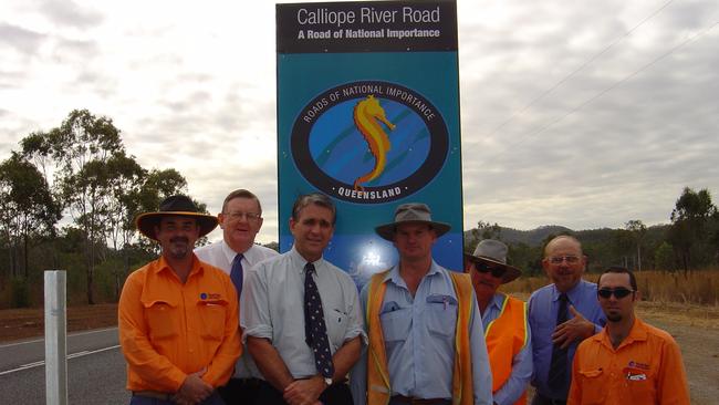 Rob Huth at a River Road project. Former Deputy PM John Anderson and Hinkler MP Paul Neville are in the group photo.