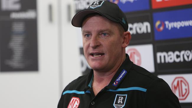 Michael Voss talks to media at a press conference. Picture: Emma Brasier